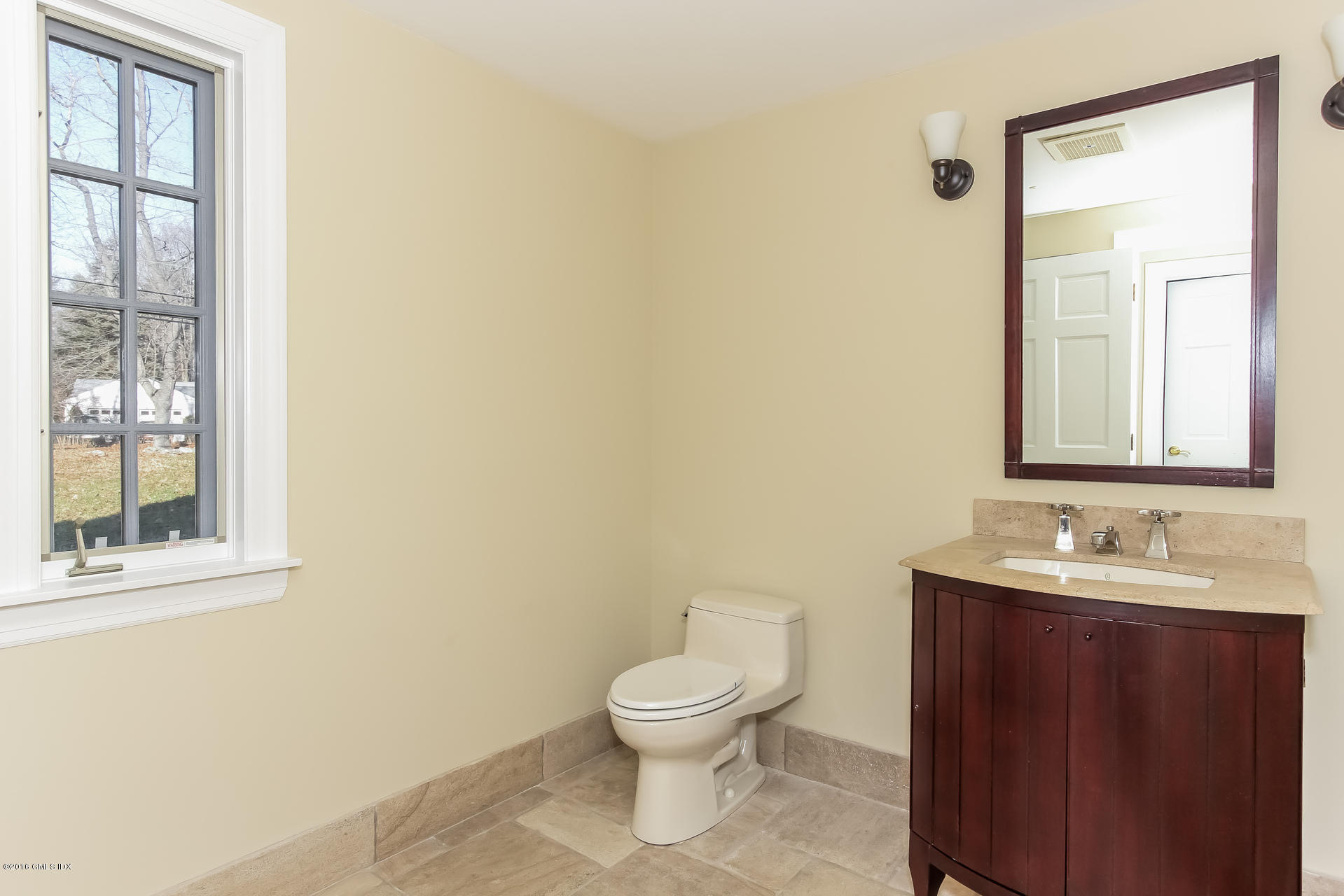 591 Round Hill Road Greenwich, CT 06831 - Photo 39 of 51 a bathroom with a toilet a sink and a mirror