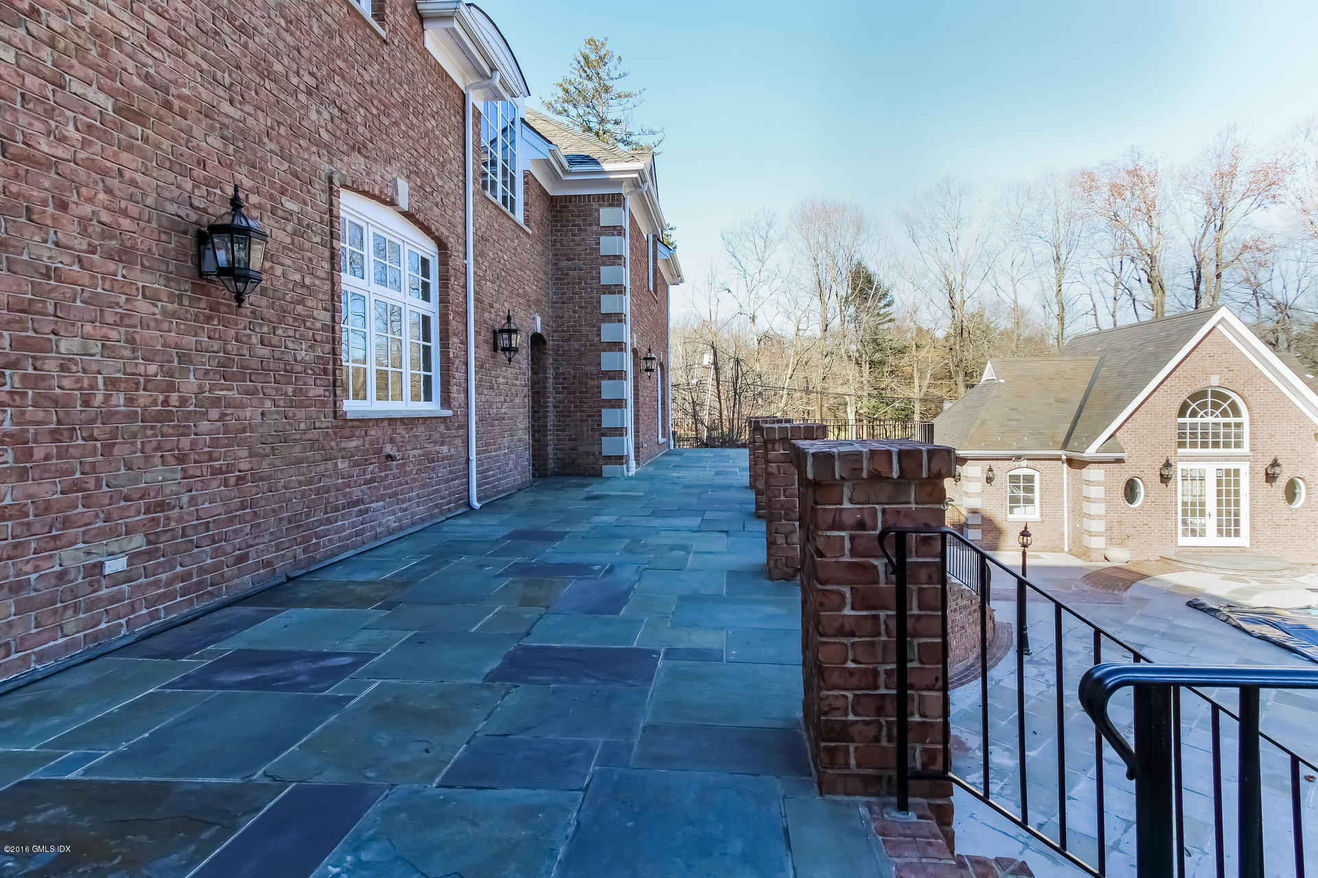 591 Round Hill Road Greenwich, CT 06831 - Photo 42 of 51 a view of residential houses with outdoor space and wooden deck