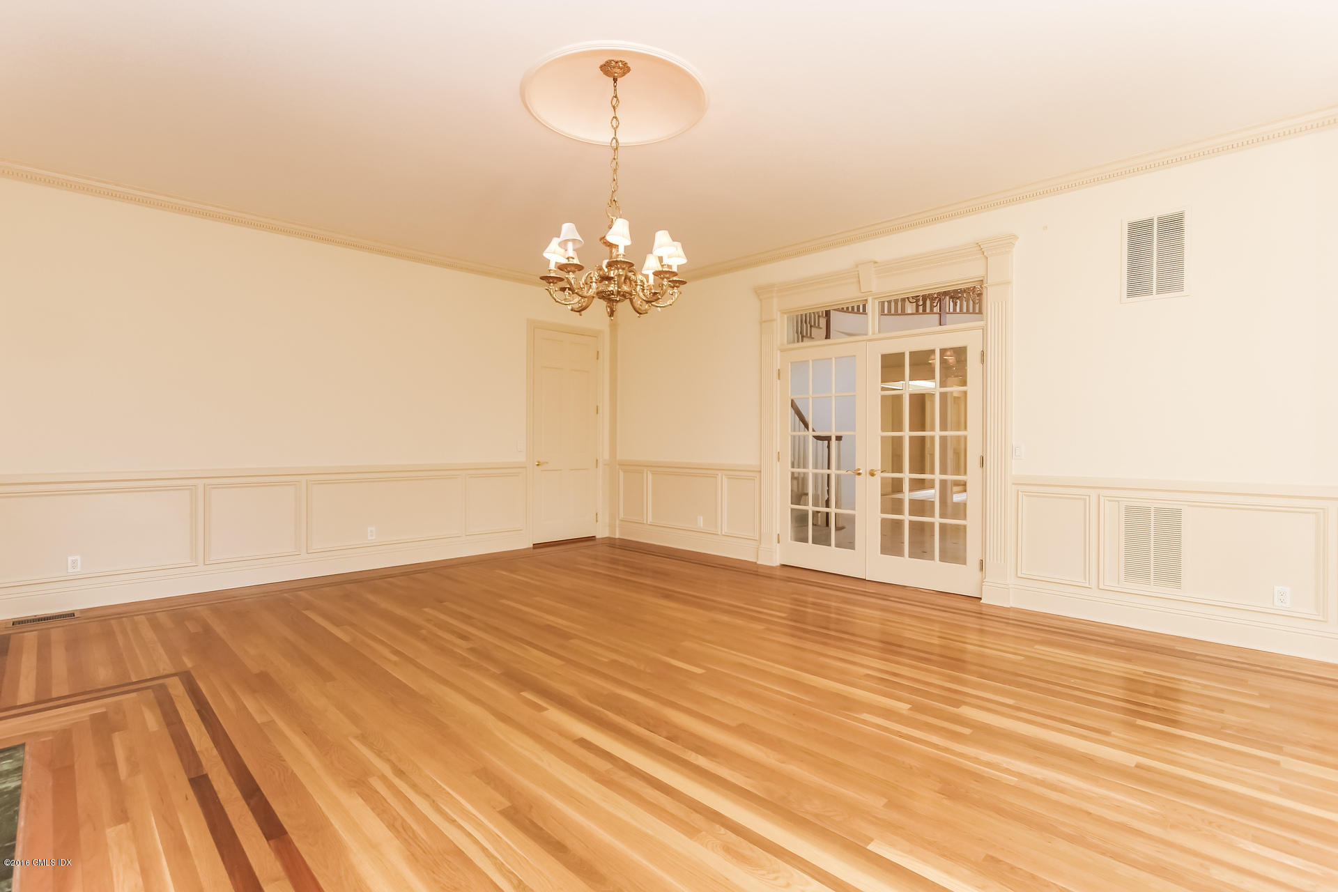 591 Round Hill Road Greenwich, CT 06831 - Photo 9 of 51 a view of empty room with wooden floor and fan
