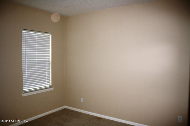 14631 Millhopper Road Jacksonville, FL 32258 - Photo 13 of 21 a room that has a window in it