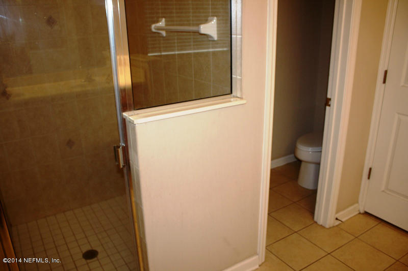 14631 Millhopper Road Jacksonville, FL 32258 - Photo 18 of 21 a bathroom with a toilet