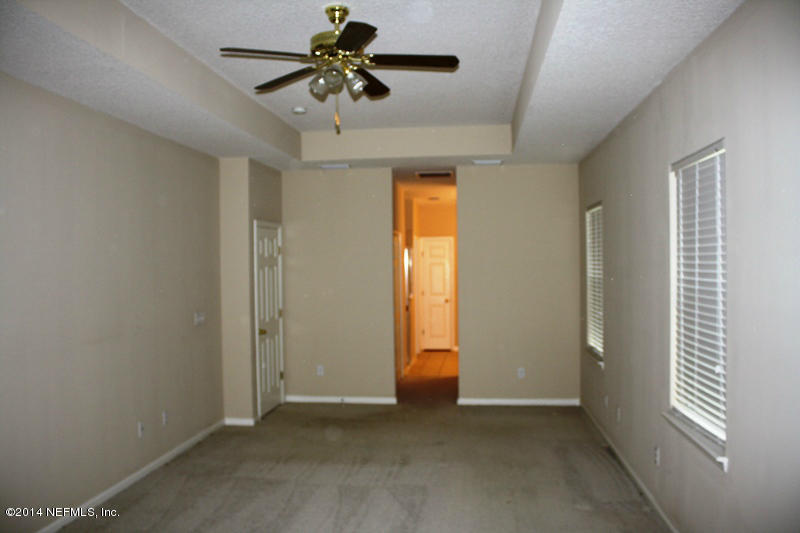 14631 Millhopper Road Jacksonville, FL 32258 - Photo 20 of 21 a view of room with a ceiling fan and window