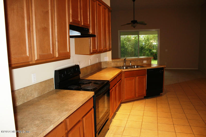 14631 Millhopper Road Jacksonville, FL 32258 - Photo 7 of 21 a kitchen with a sink and large cabinets