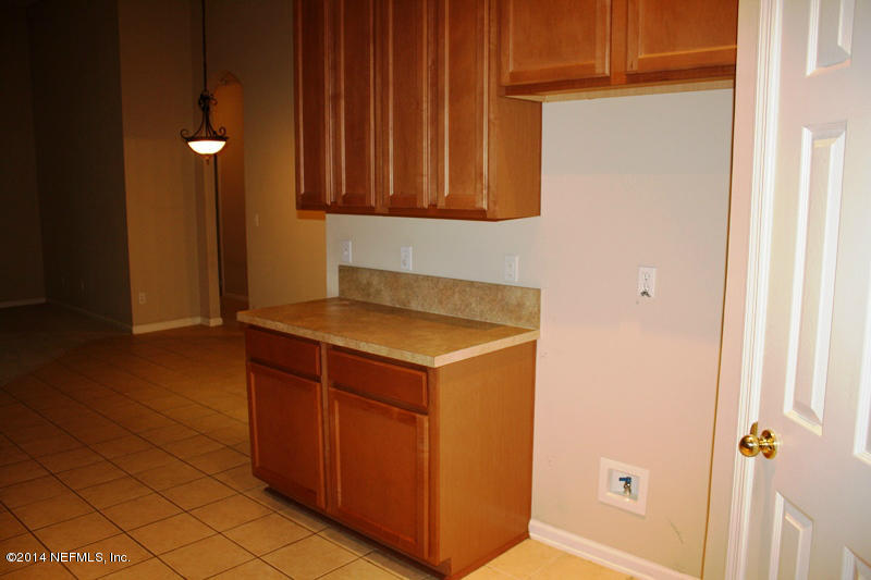 14631 Millhopper Road Jacksonville, FL 32258 - Photo 8 of 21 a view of cabinets and wooden floor