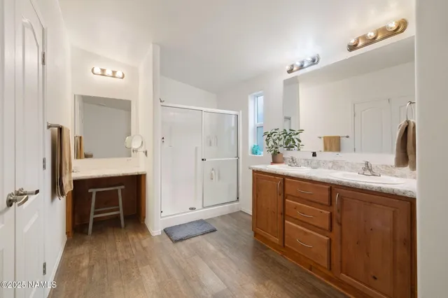 a bathroom with a sink vanity and a toilet