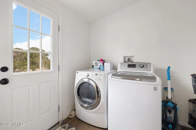 a bathroom with a granite countertop sink and a toilet