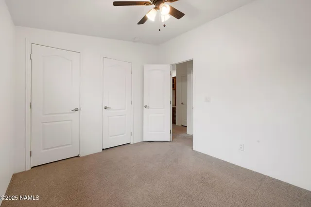 a bedroom with bed and a window