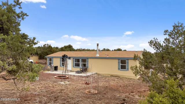 a view of a patio with table and chairs