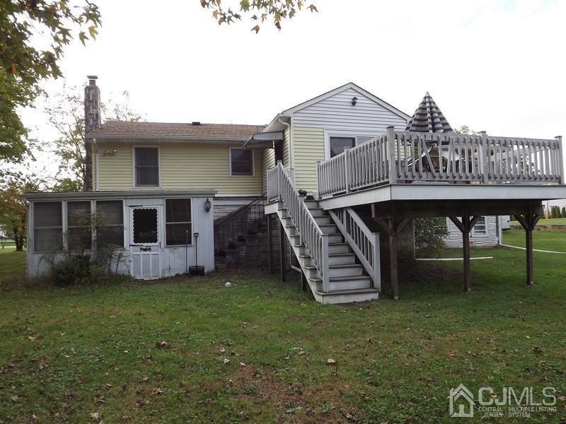 3 Butcher Road Monroe Township, NJ 08831 - Photo 11 of 11 a view of a house with a yard porch and sitting area