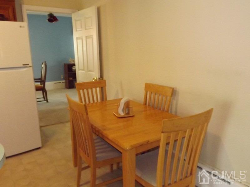 3 Butcher Road Monroe Township, NJ 08831 - Photo 5 of 11 a view of an outdoor dining space with furniture