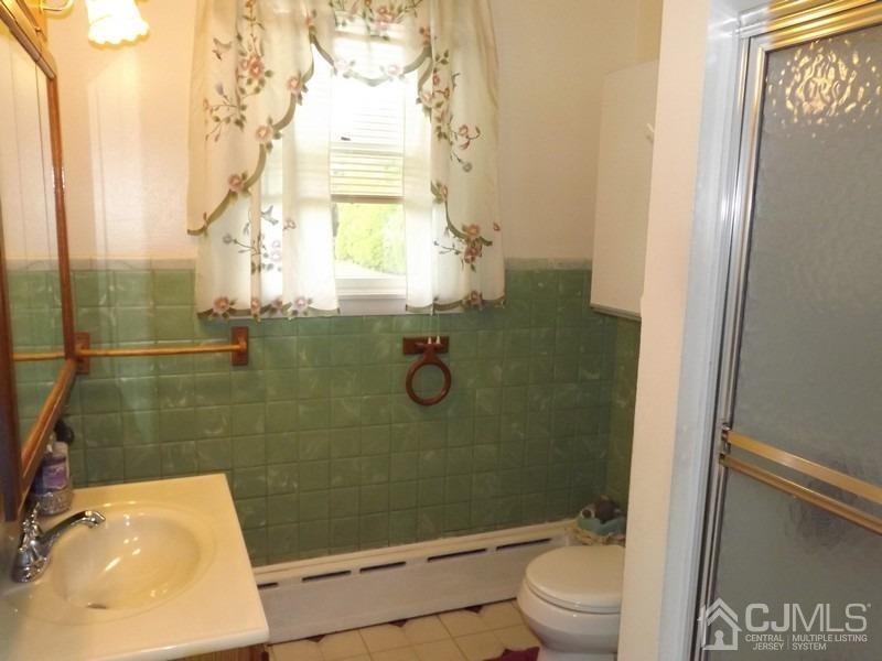 3 Butcher Road Monroe Township, NJ 08831 - Photo 9 of 11 a bathroom with a sink and a shower