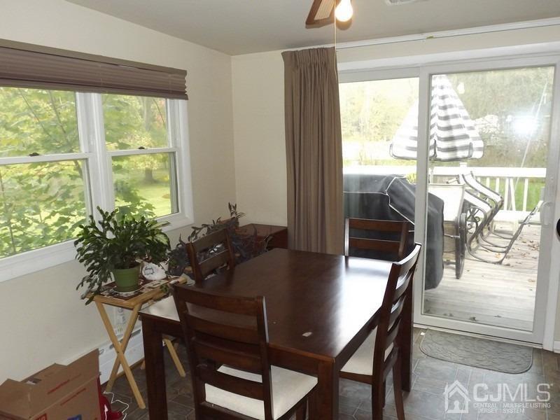 3 Butcher Road Monroe Township, NJ 08831 - Photo 10 of 11 a view of a dining room with furniture window and outside view