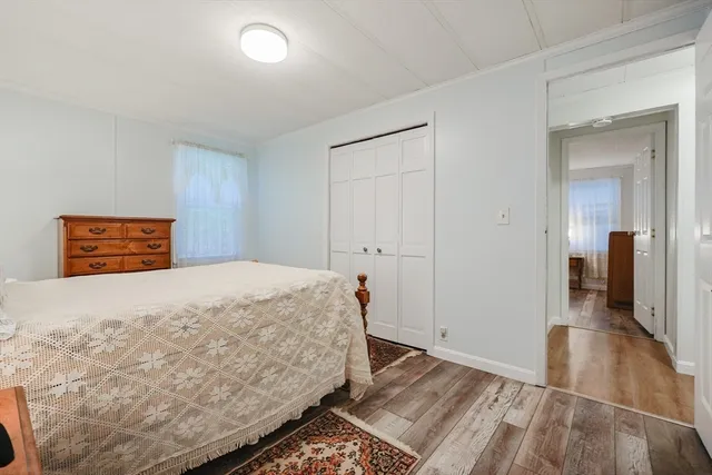 a bedroom with a bed and a walk in closet