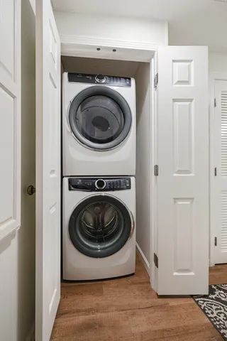 a view of a storage & utility room with a washer dryer