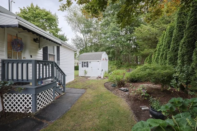 a view of a wooden deck front of house
