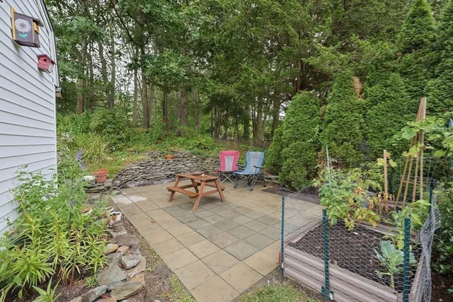 a view of a backyard with sitting area