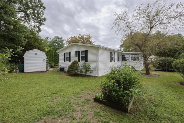 a front view of house with garden