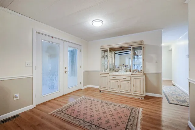 a room with mirror and window