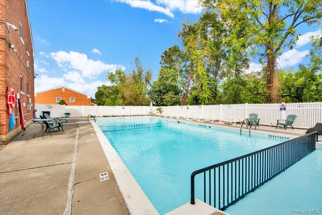 swimming pool view with seating space
