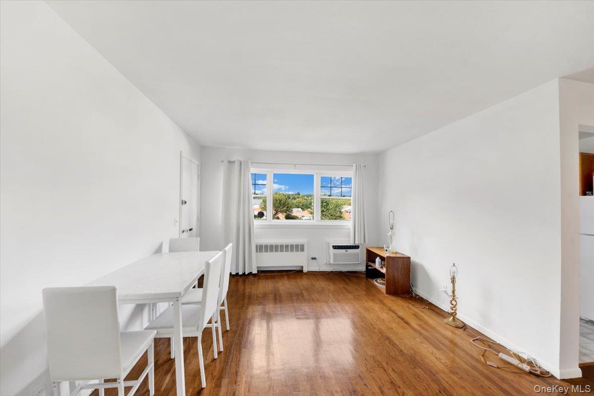 1879 Crompond Road, Unit G10 Peekskill, NY 10566 - Photo 9 of 18 a living room with furniture and a wooden floor