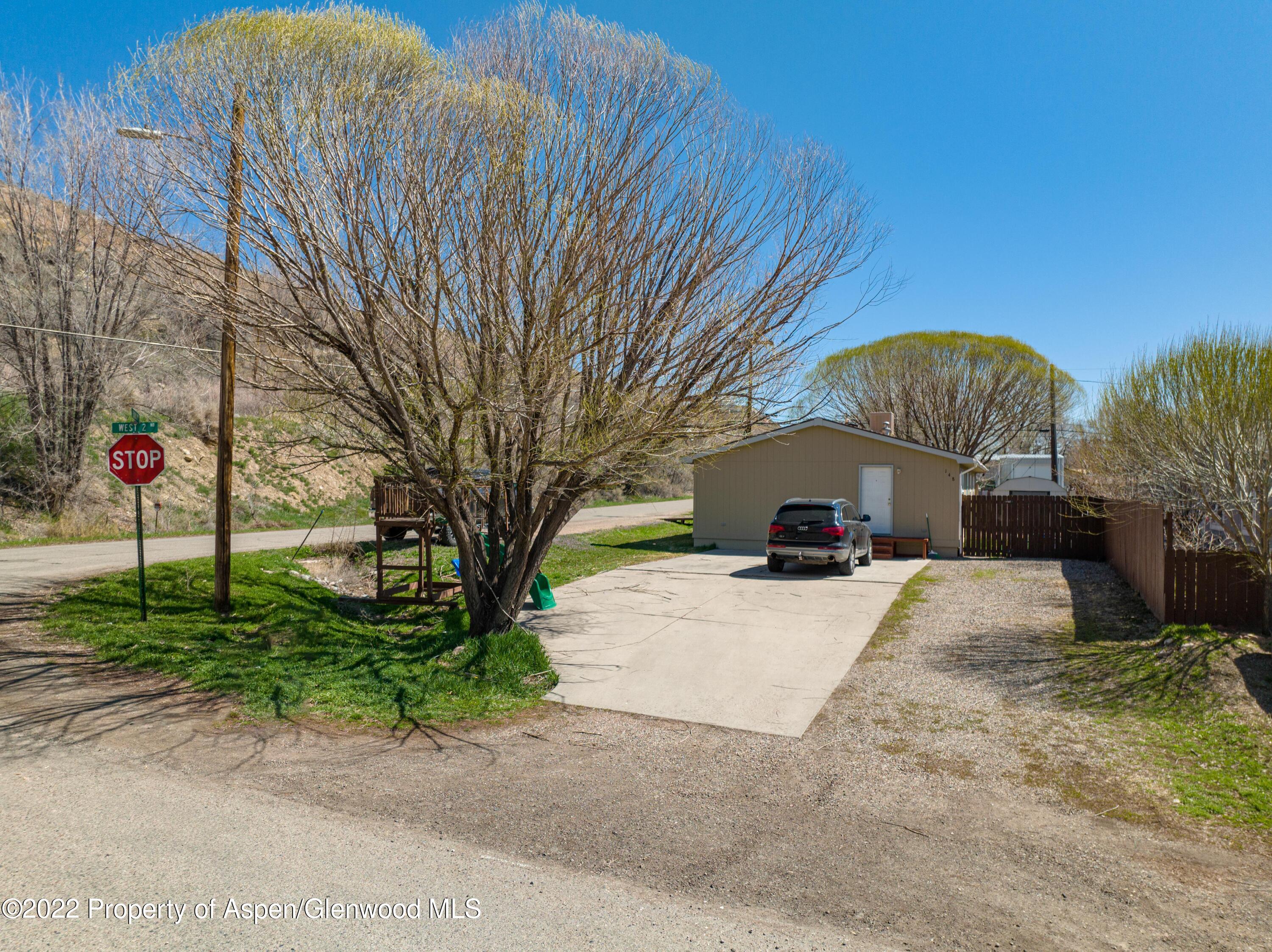 148 Ray Avenue Rifle, CO 81650 - Photo 2 of 13 a front view of a house with garden