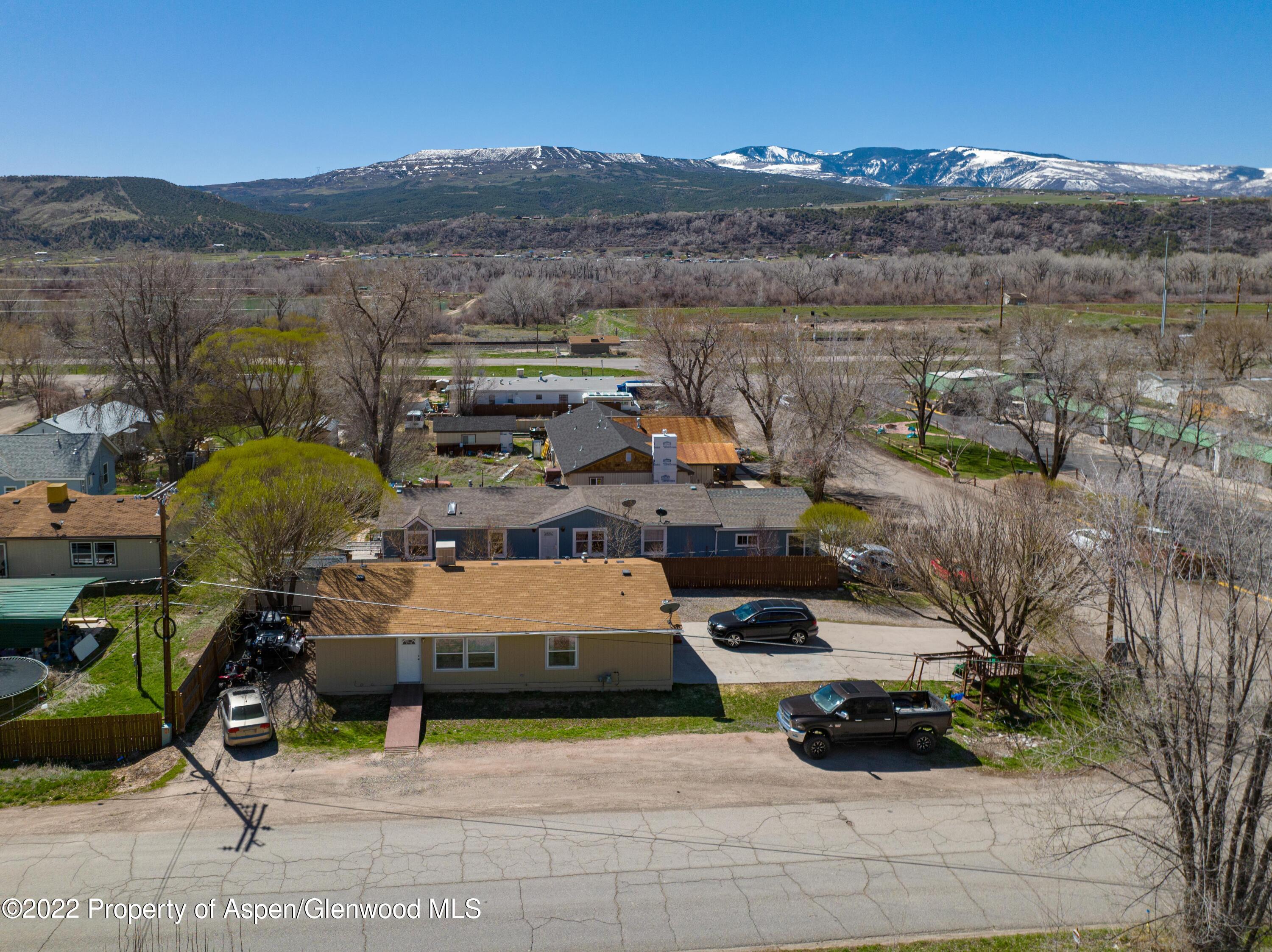 148 Ray Avenue Rifle, CO 81650 - Photo 3 of 13 an aerial view of a house with a garden