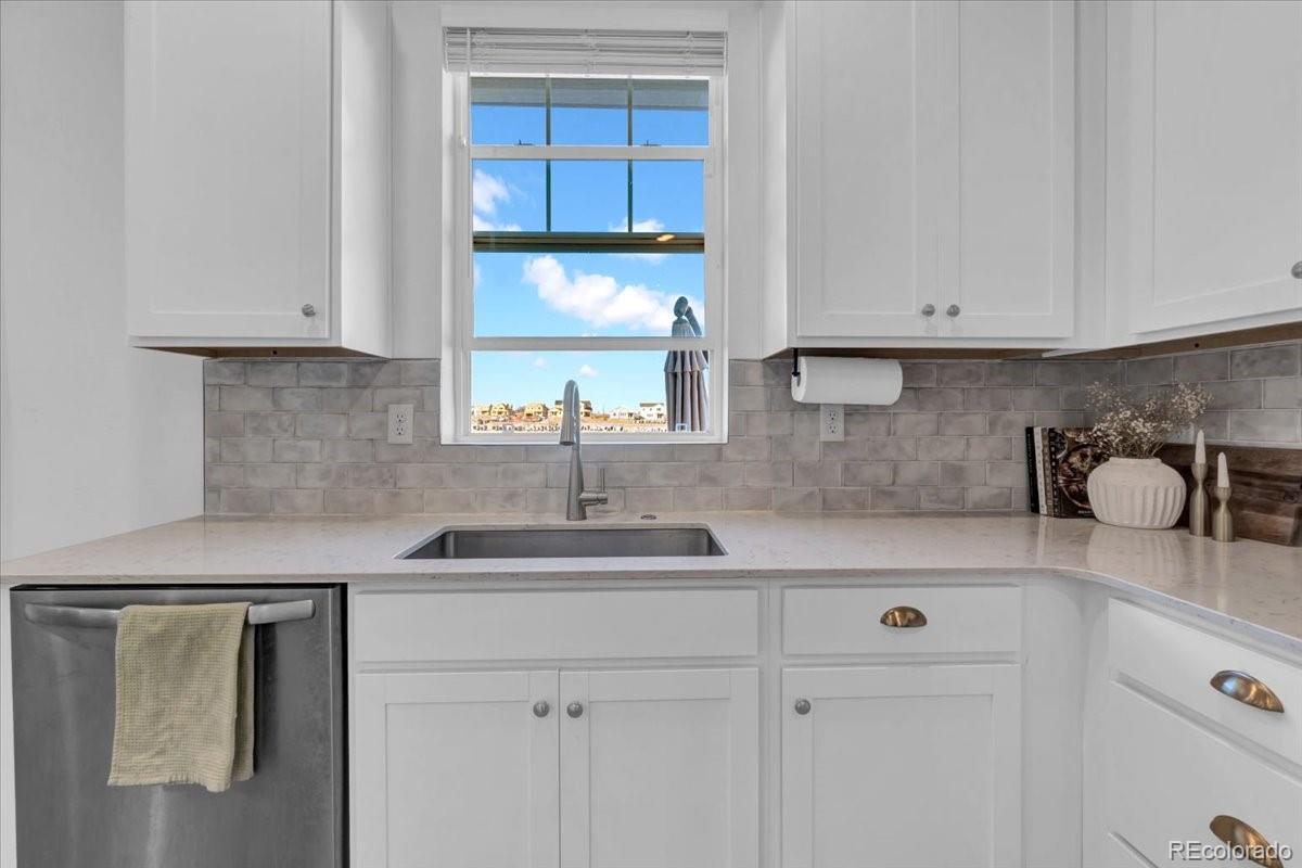 5453 Inland Avenue Firestone, CO 80504 - Photo 17 of 49 a kitchen with a sink cabinets and window