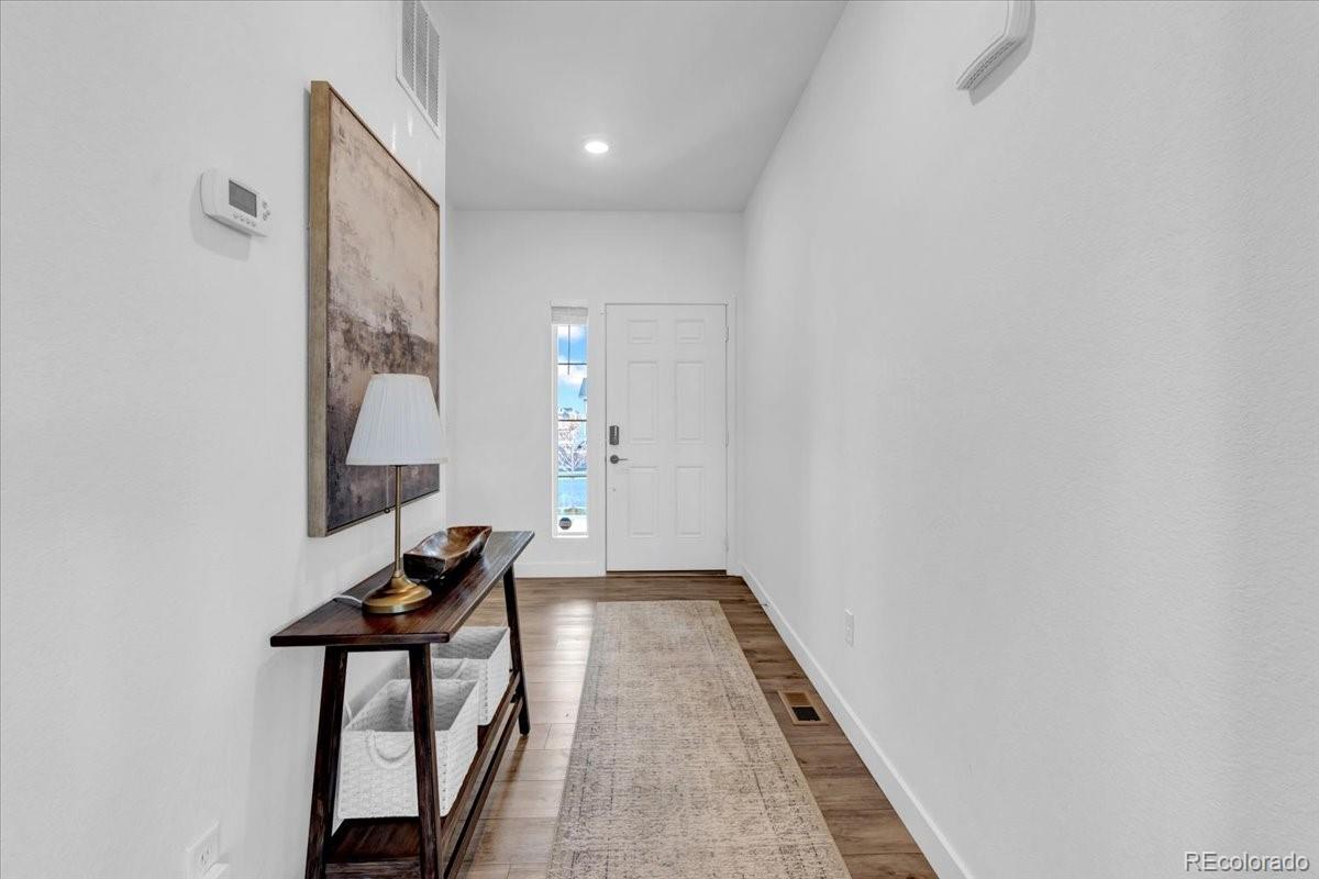 5453 Inland Avenue Firestone, CO 80504 - Photo 18 of 49 a view of entryway with wooden floor