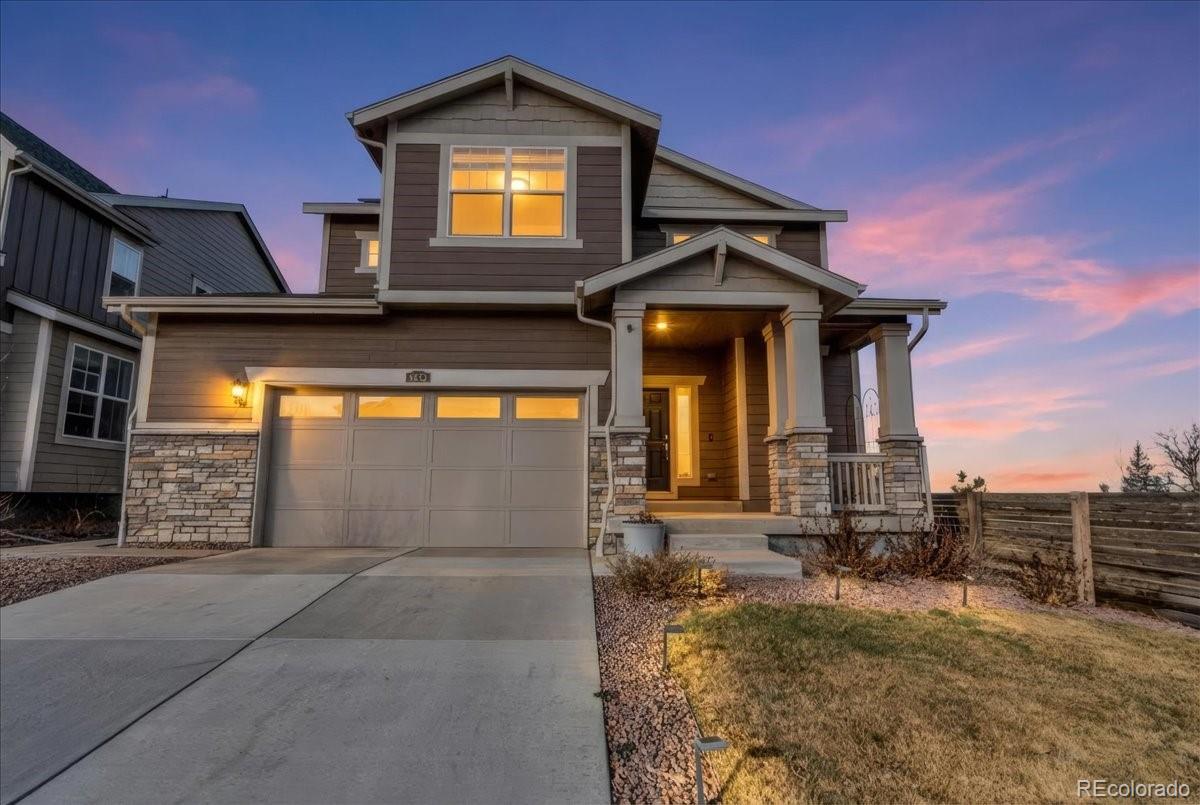 5453 Inland Avenue Firestone, CO 80504 - Photo 2 of 49 a front view of a house with a yard