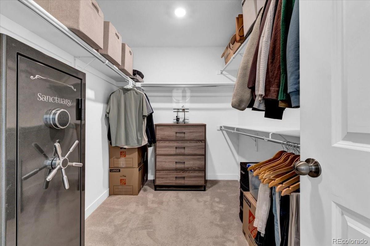 5453 Inland Avenue Firestone, CO 80504 - Photo 24 of 49 a view of walk in closet with clothes and shoes