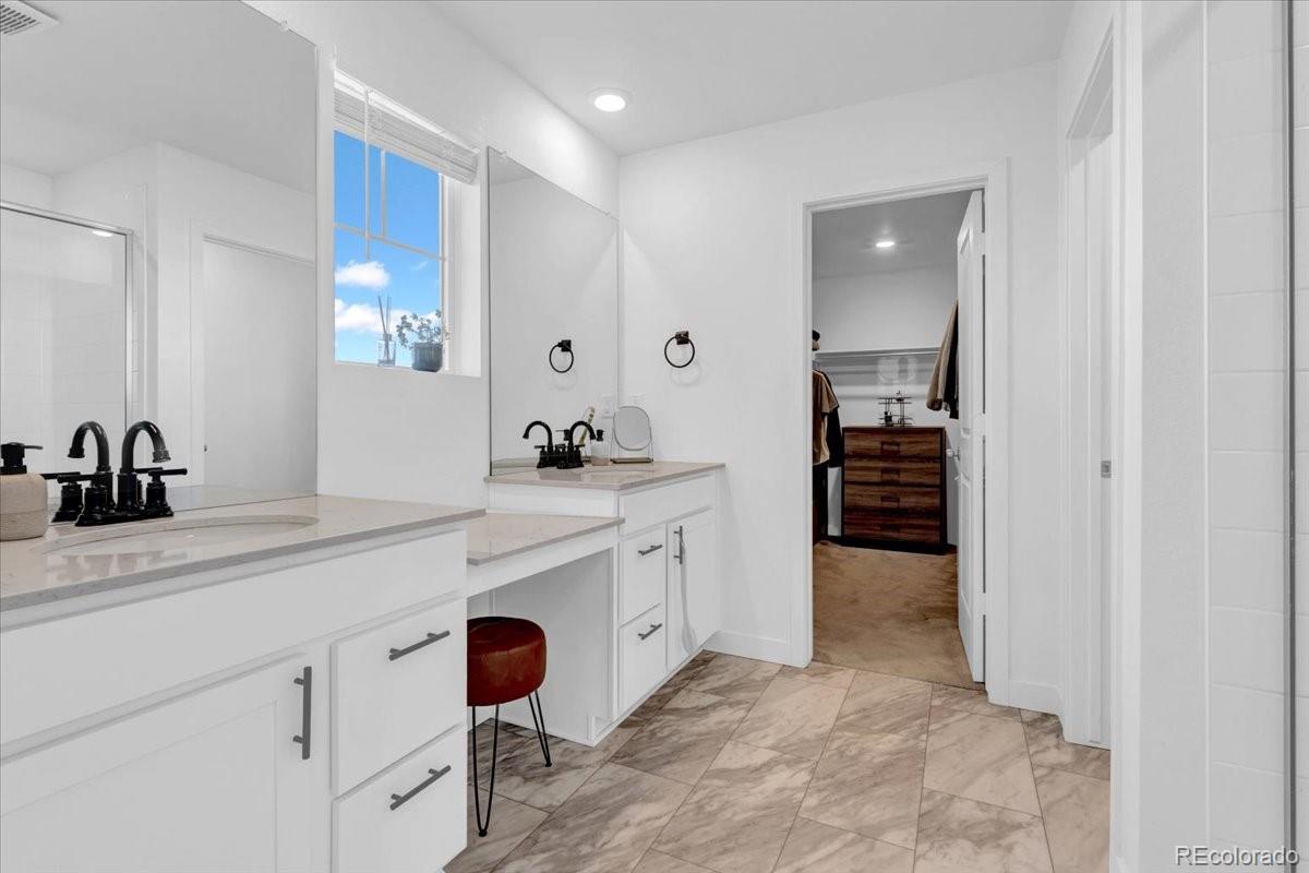 5453 Inland Avenue Firestone, CO 80504 - Photo 25 of 49 a spacious bathroom with a shower sink and toilet