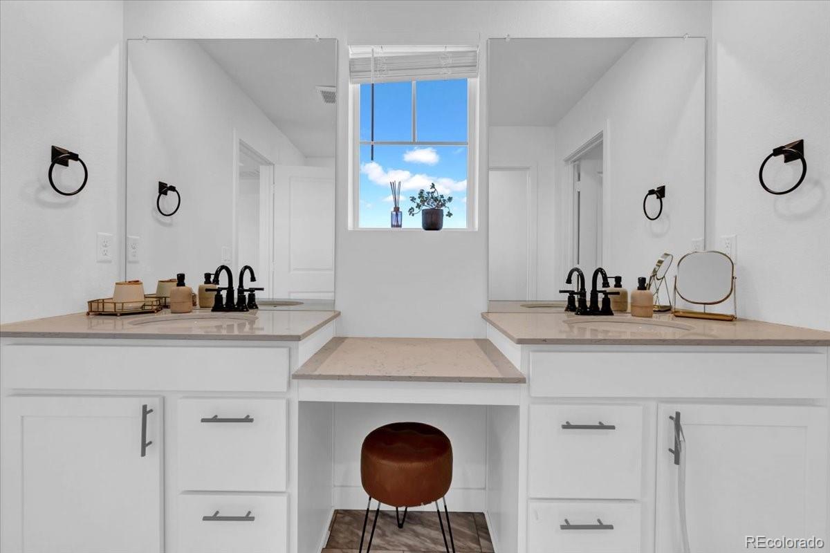 5453 Inland Avenue Firestone, CO 80504 - Photo 27 of 49 a bathroom with a sink and a mirror