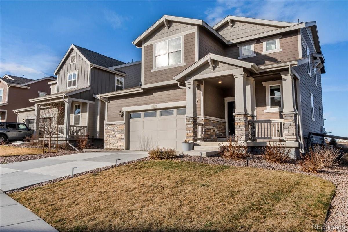 5453 Inland Avenue Firestone, CO 80504 - Photo 3 of 49 a front view of a house with a yard