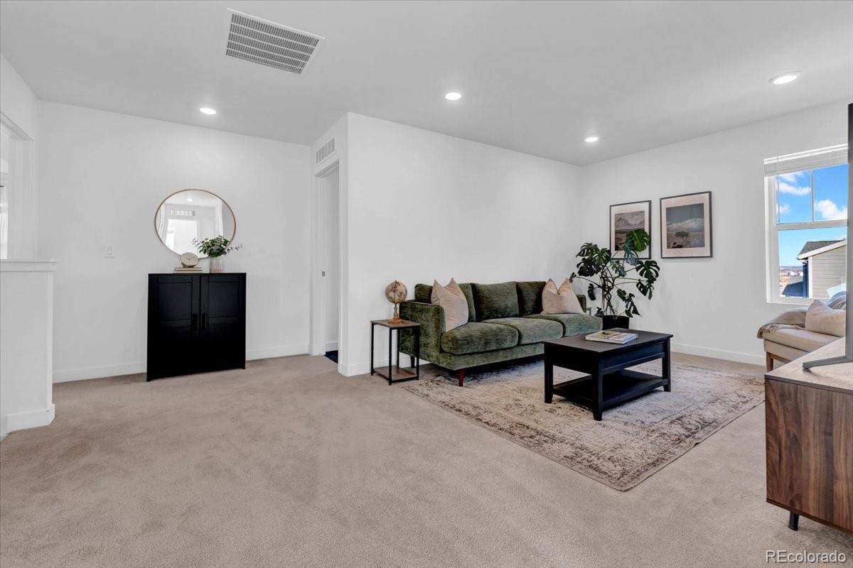 5453 Inland Avenue Firestone, CO 80504 - Photo 33 of 49 a living room with furniture and a window
