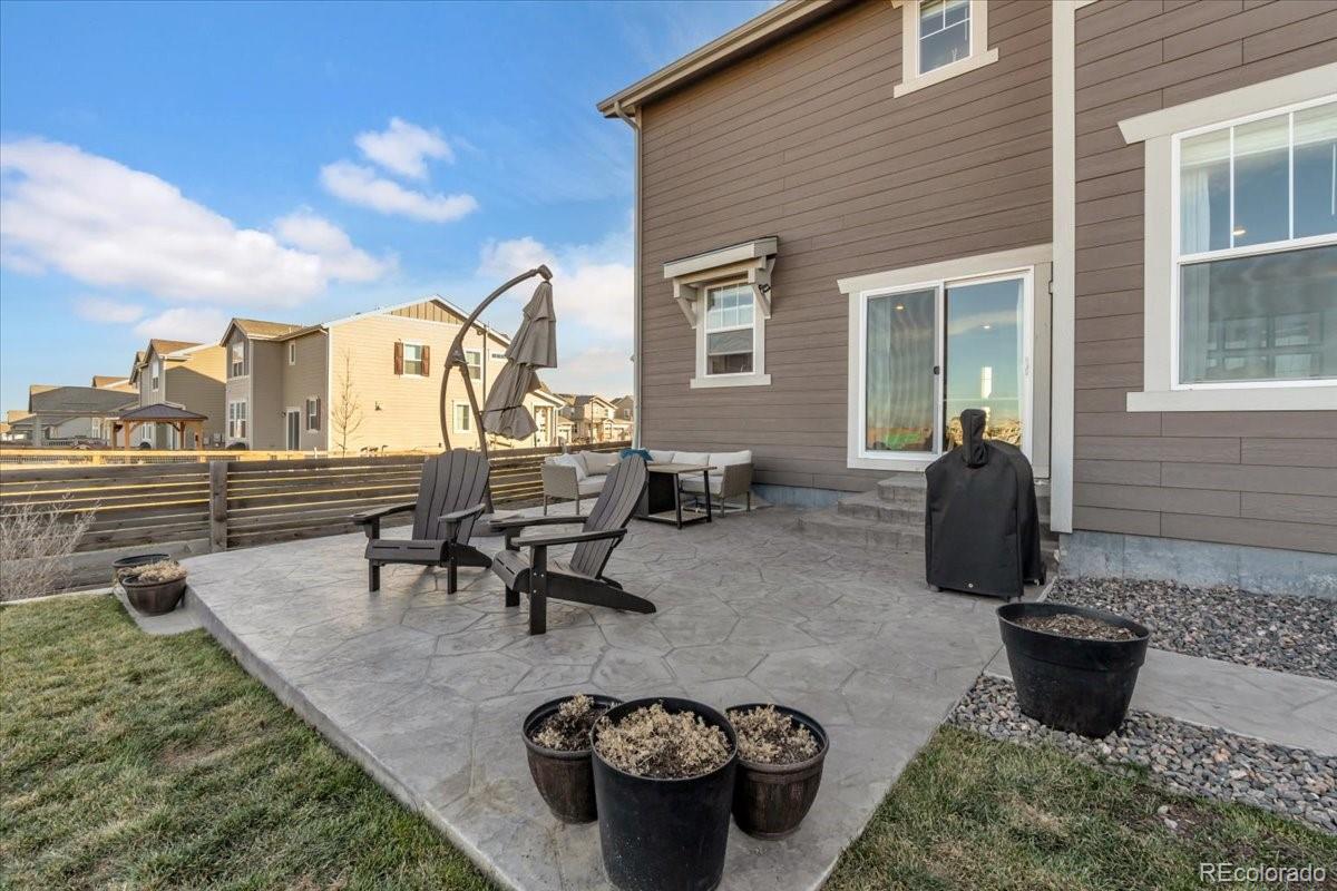 5453 Inland Avenue Firestone, CO 80504 - Photo 38 of 49 a view of a patio with chairs and plants