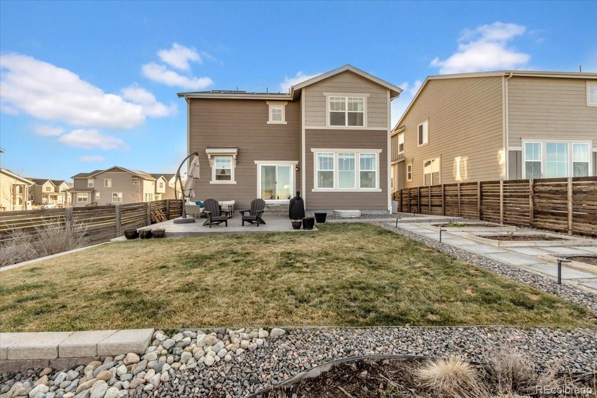 5453 Inland Avenue Firestone, CO 80504 - Photo 39 of 49 a front view of a house with a yard