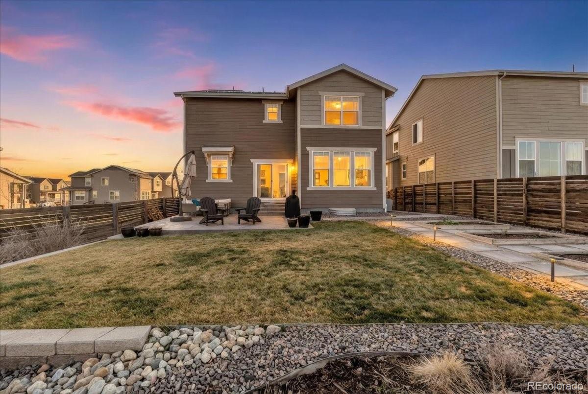 5453 Inland Avenue Firestone, CO 80504 - Photo 40 of 49 a front view of a house with a yard