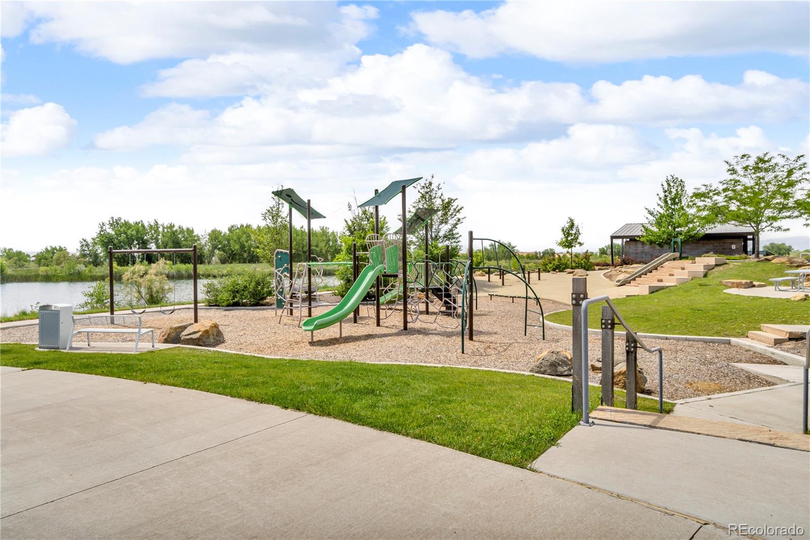 5453 Inland Avenue Firestone, CO 80504 - Photo 47 of 49 a view of a park with swings and slides