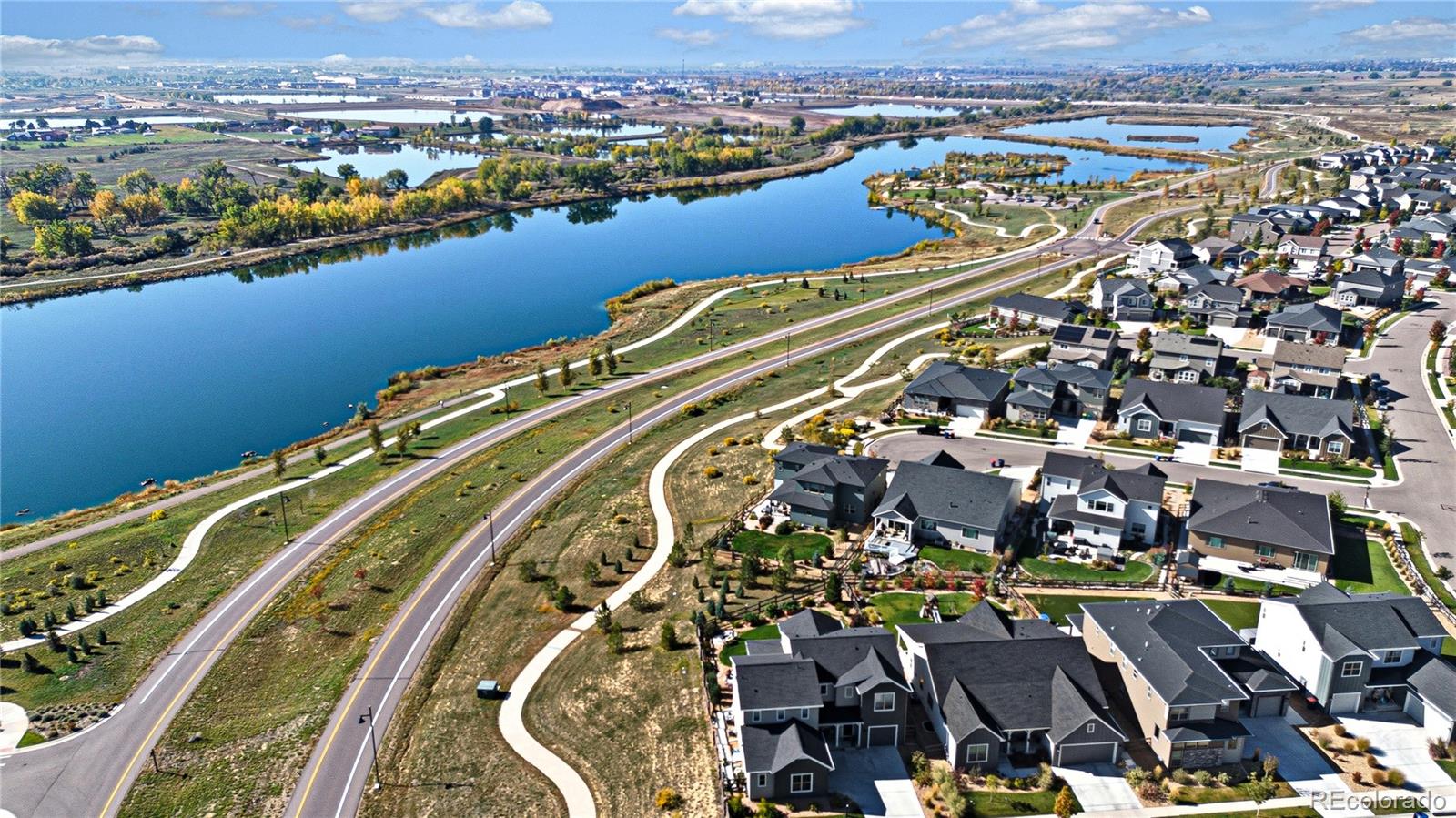 5453 Inland Avenue Firestone, CO 80504 - Photo 49 of 49 an aerial view of residential building and lake