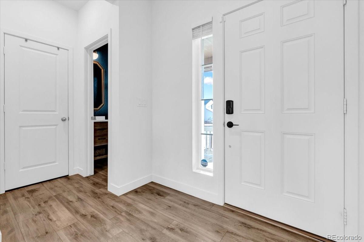 5453 Inland Avenue Firestone, CO 80504 - Photo 6 of 49 an empty room with wooden floor and closet