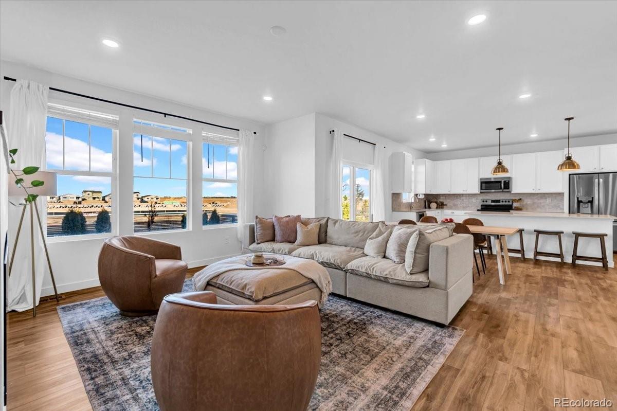 5453 Inland Avenue Firestone, CO 80504 - Photo 7 of 49 a living room with furniture and a large window