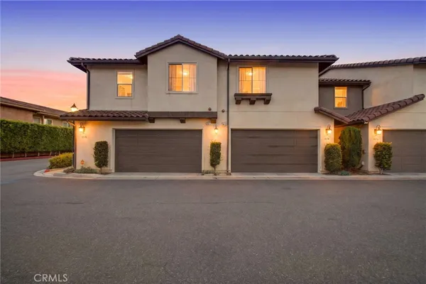a front view of a house with yard