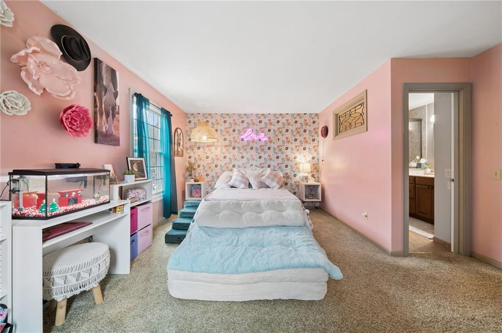 55 Spring Valley Drive Washington, PA 15301 - Photo 13 of 36 a living room with furniture and a bed