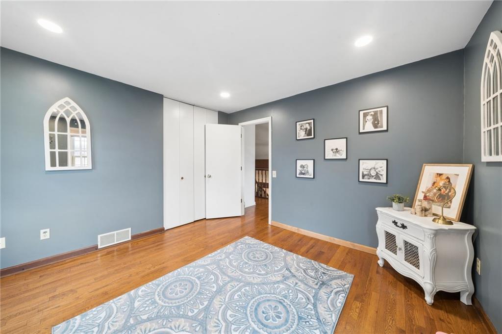 55 Spring Valley Drive Washington, PA 15301 - Photo 17 of 36 a bedroom with a bed and wooden floor