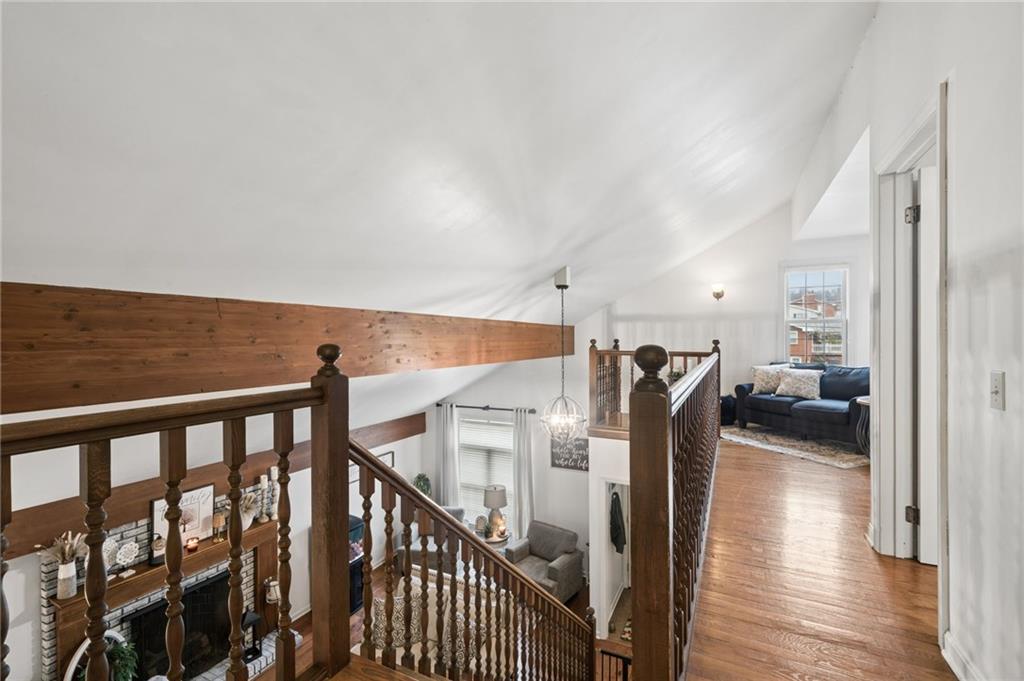 55 Spring Valley Drive Washington, PA 15301 - Photo 23 of 36 a view of a hallway with wooden floor and stairs