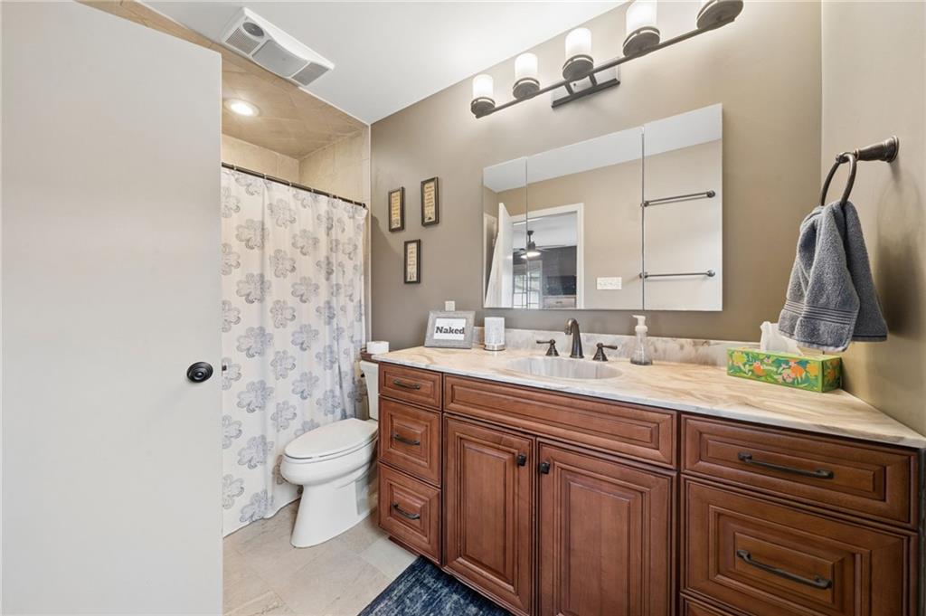 55 Spring Valley Drive Washington, PA 15301 - Photo 27 of 36 a bathroom with a double vanity sink toilet and mirror