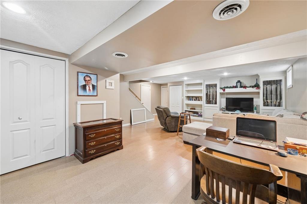 55 Spring Valley Drive Washington, PA 15301 - Photo 28 of 36 a living room with furniture and a flat screen tv