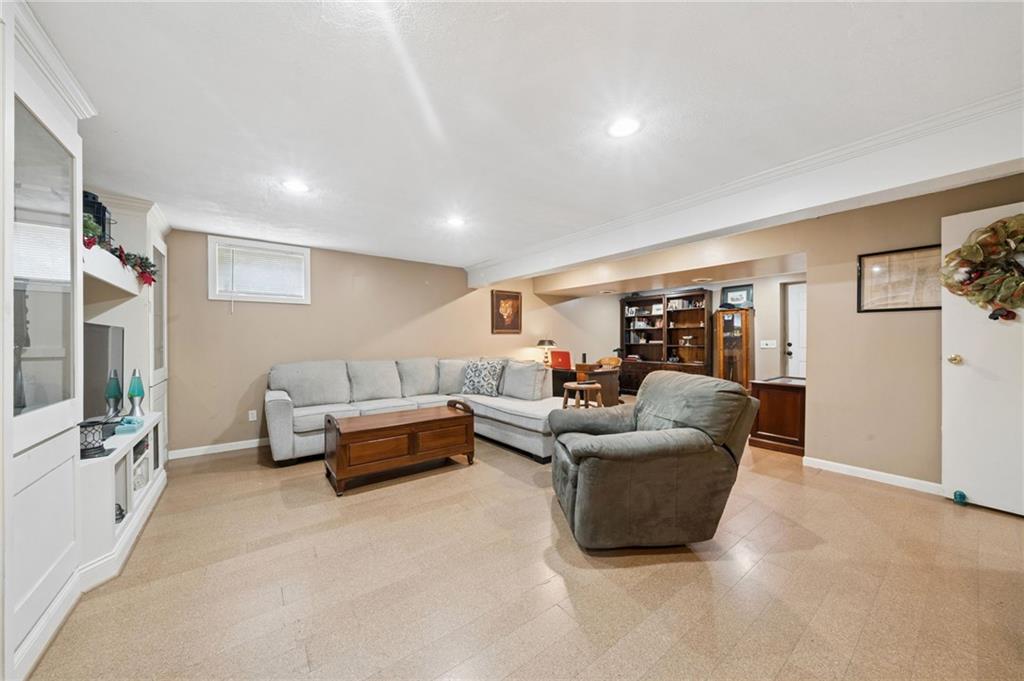 55 Spring Valley Drive Washington, PA 15301 - Photo 29 of 36 a living room with furniture and a flat screen tv