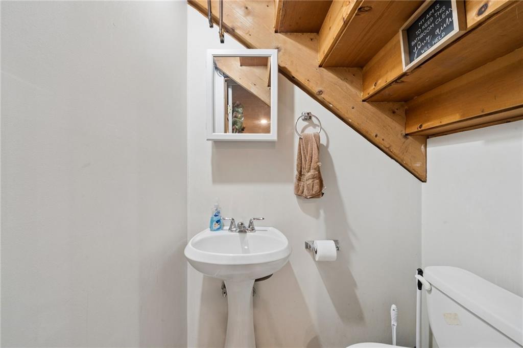 55 Spring Valley Drive Washington, PA 15301 - Photo 30 of 36 a bathroom with a sink and mirror with toilet