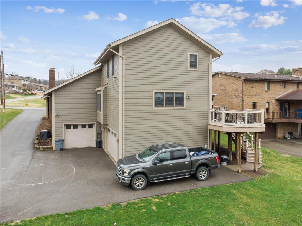55 Spring Valley Drive Washington, PA 15301 - Photo 31 of 36 a car parked in front of a house